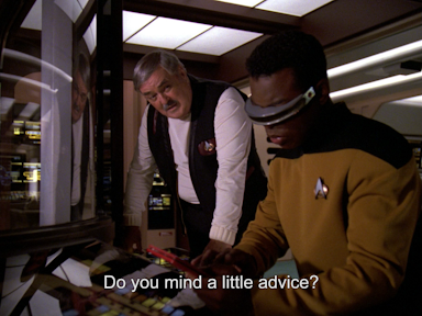 Scotty leans in towards Geordi in the Enterprise D’s main engineering and asks, “Do you mind a little advice?”
